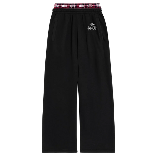 Black wide leg sweatpants with plaid waistband and minimal white emblem detail