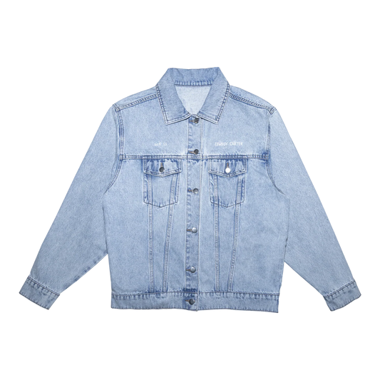Light blue denim jacket with button front and subtle Beyoncé Cowboy Carter text on chest