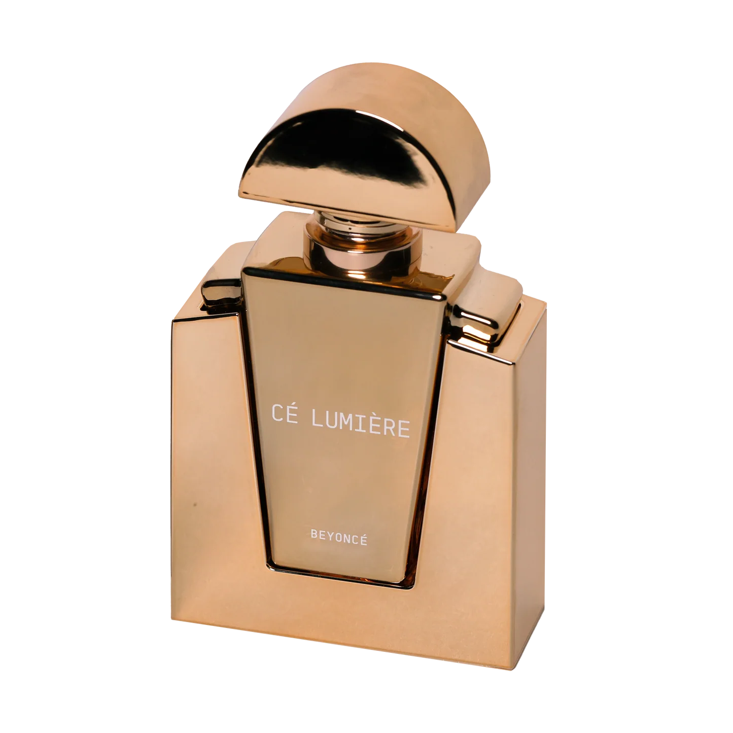 Gold Cé Lumière Beyoncé perfume bottle close up with reflective metallic finish