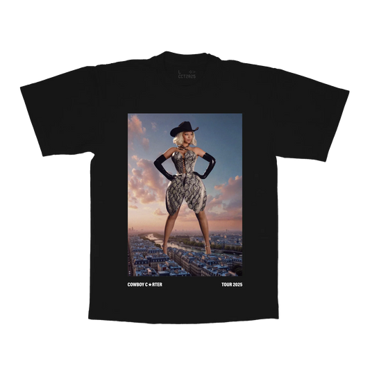 Black t-shirt front featuring Cowboy Carter Beyoncé tour graphic with western outfit over city skyline and tour 2025 text