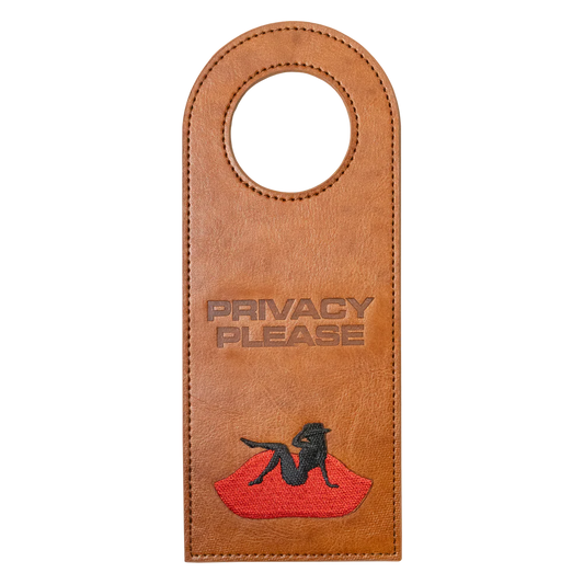 Brown leather door tag with Privacy Please text and Beyoncé silhouette graphic on red lips